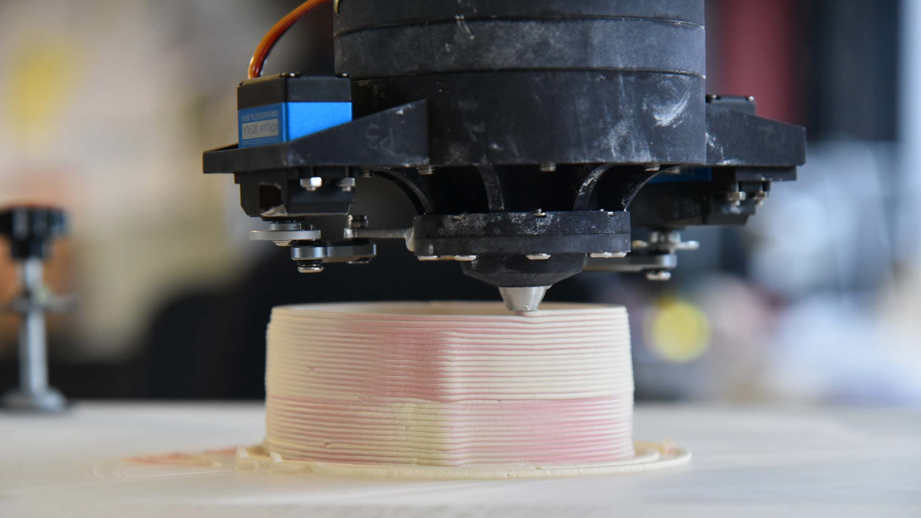 Graphic of a typography specimen showing the alphabet and numerals on top of a dark gray background.